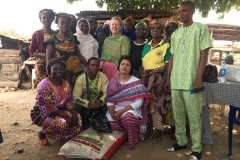 in the village. Handing over a sack of rice to the widows